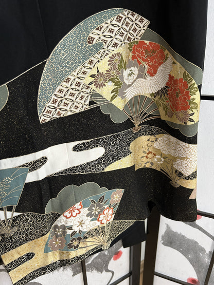 Black kimono wrap skirt, detail of fans with red peonies at hem