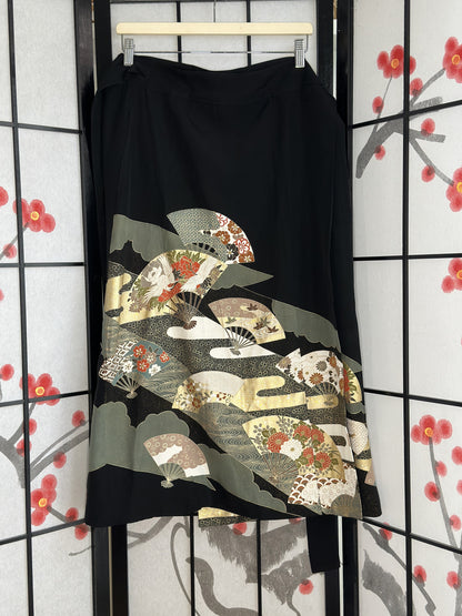 Black kimono wrap skirt with folding fan design in green and cream, full view