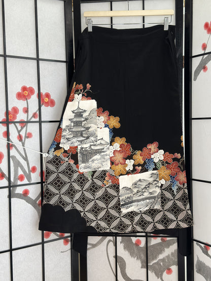 Black kimono wrap skirt with pagoda scenes and autumn leaves, full view