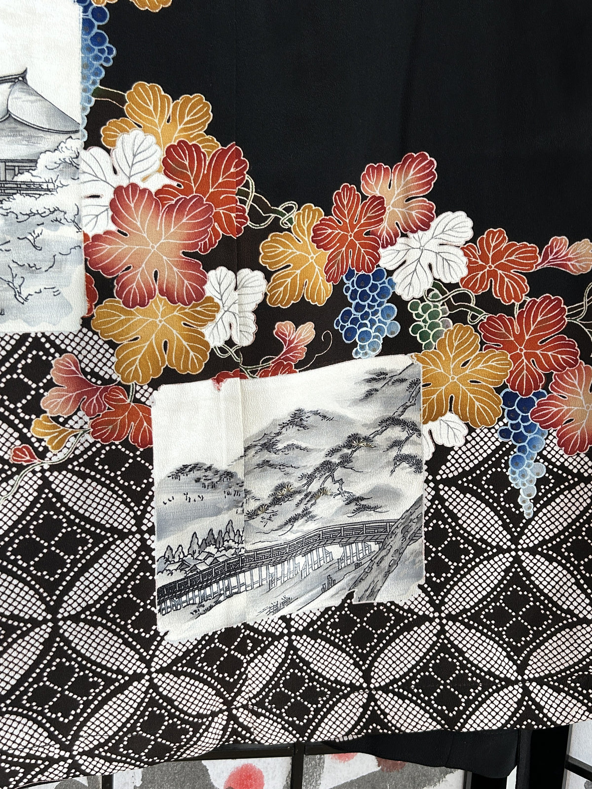 Black kimono wrap skirt, detail of mountain scene, leaves and dotted pattern