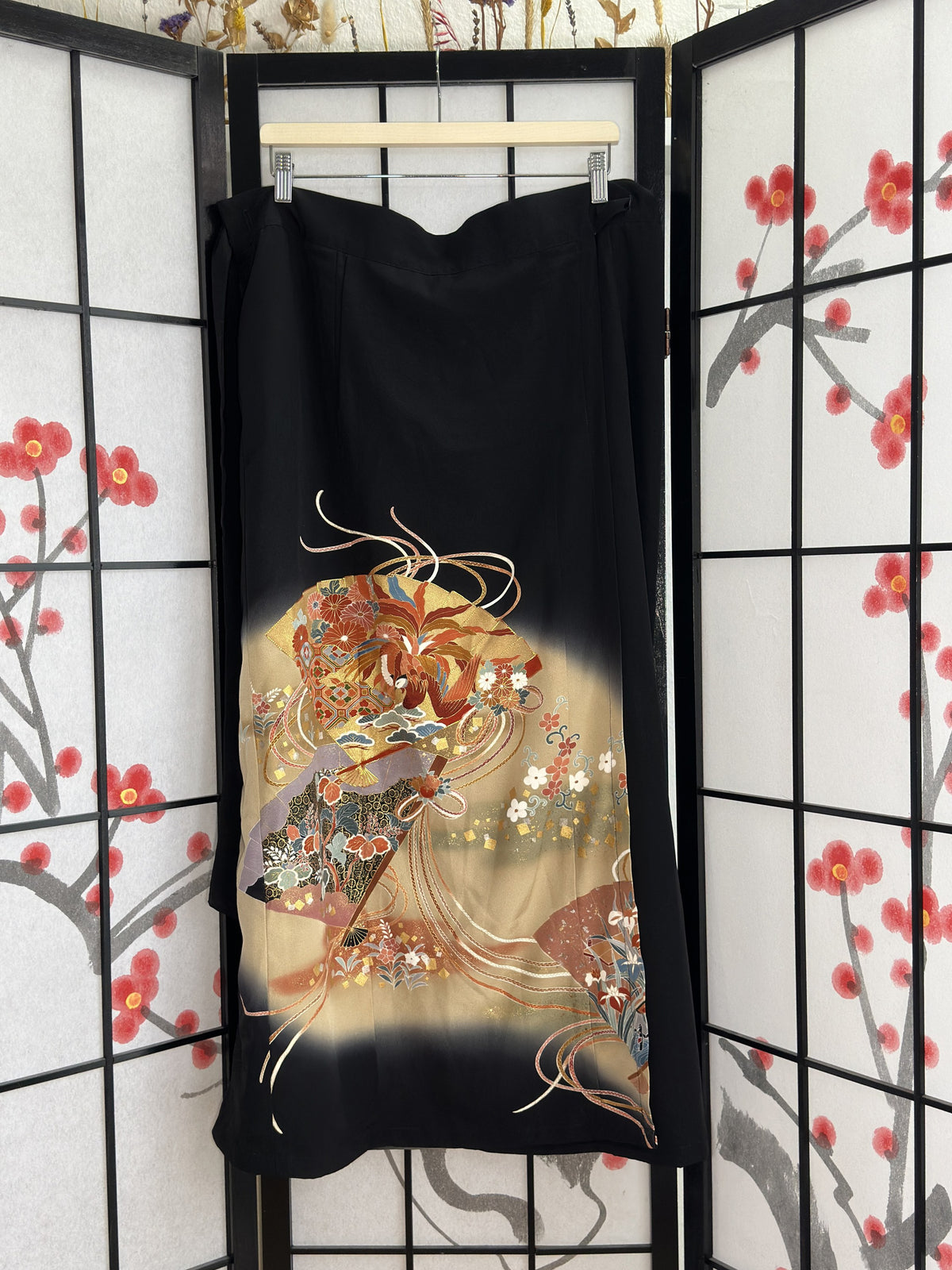 Black kimono wrap skirt with gold fan and bird design, full view