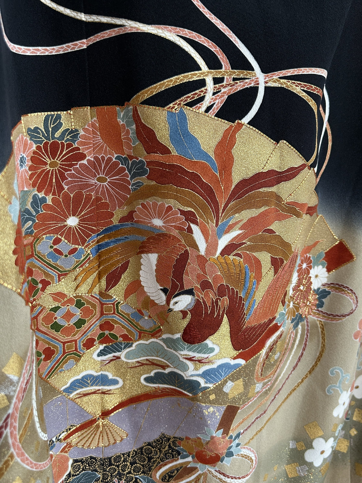 Black kimono wrap skirt, close-up of red long-tailed bird and chrysanthemums