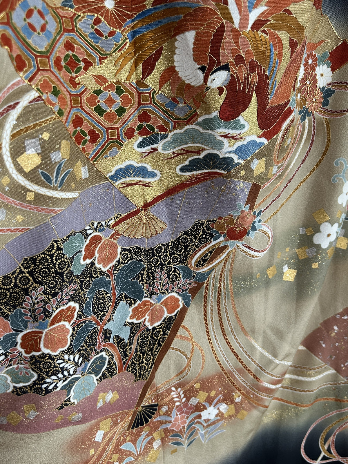Black kimono wrap skirt, detail of gold fans, bird and flowers