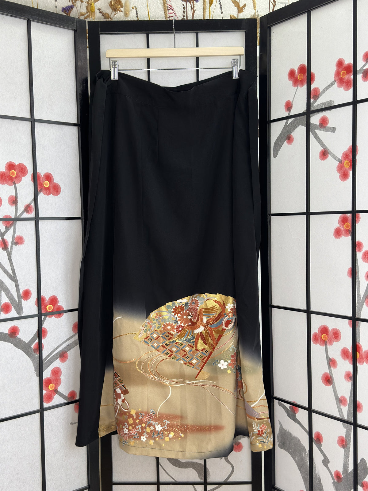Black kimono wrap skirt with beige and gold design, second full view