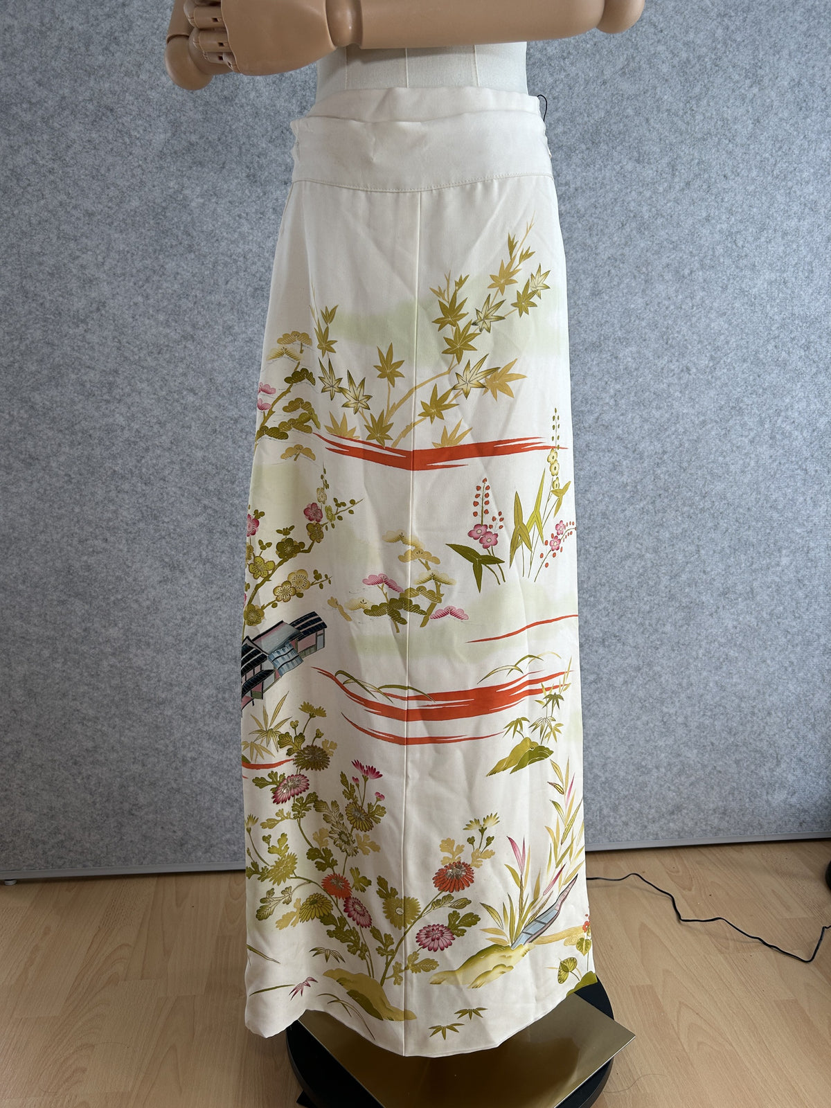 Cream kimono wrap skirt with olive, pink and orange scenic floral design, full view