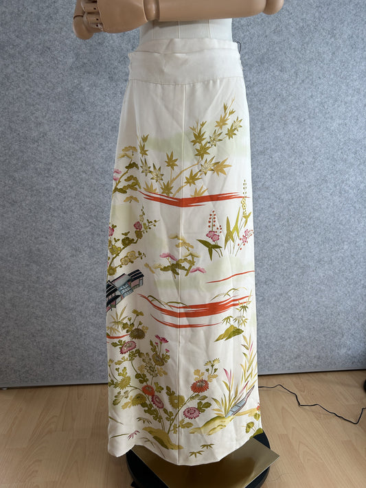 Cream kimono wrap skirt with olive, pink and orange scenic floral design, full view
