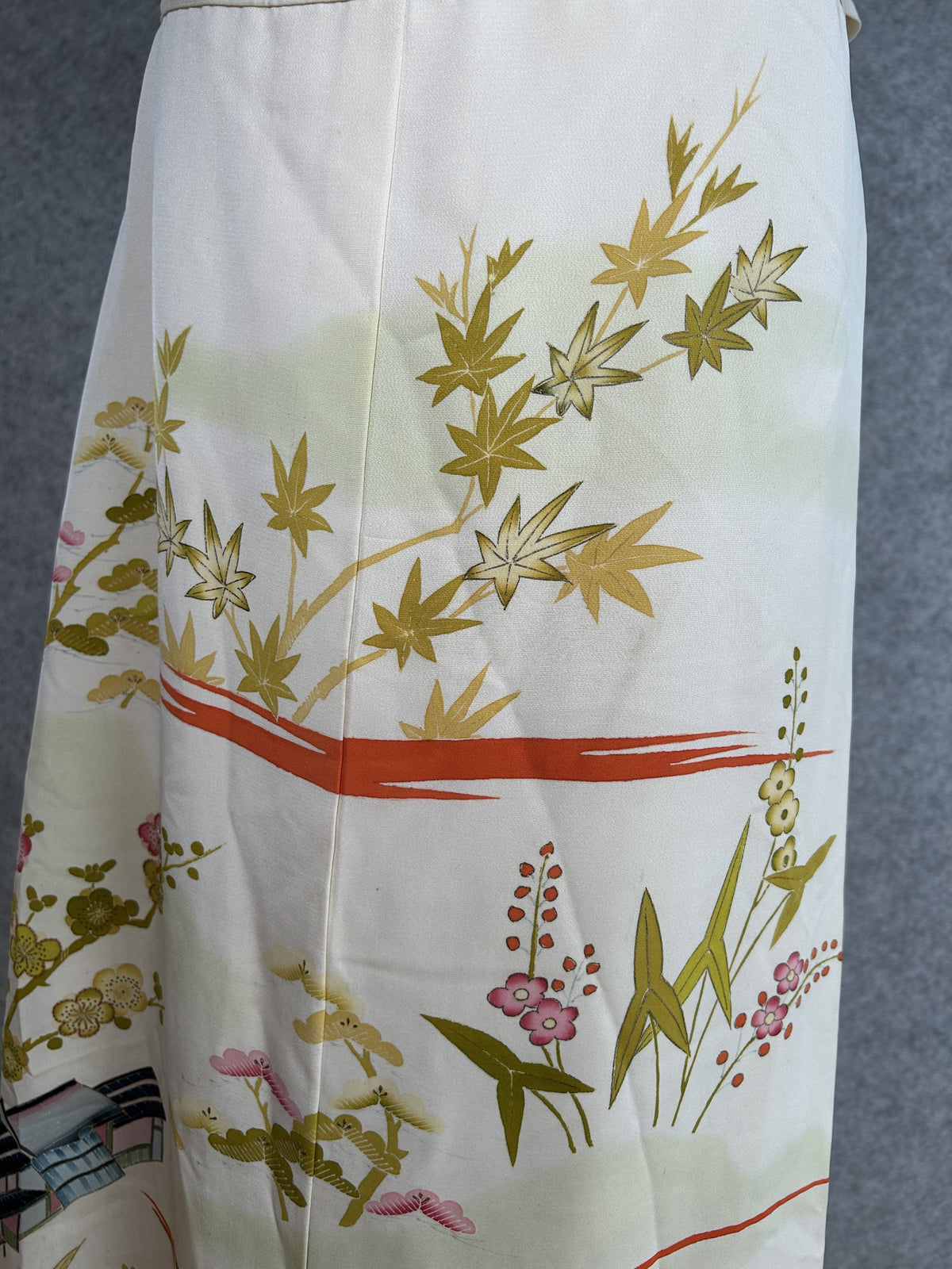 Cream kimono skirt, close-up of olive maple leaves and pink flowers