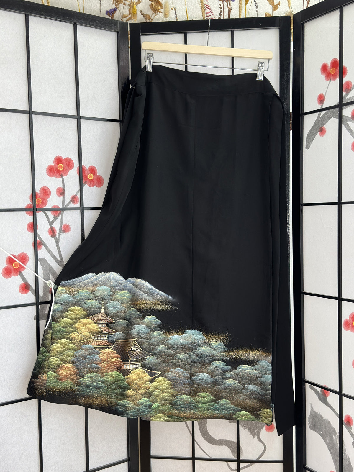 Black kimono wrap skirt with pagoda and forest landscape, full view