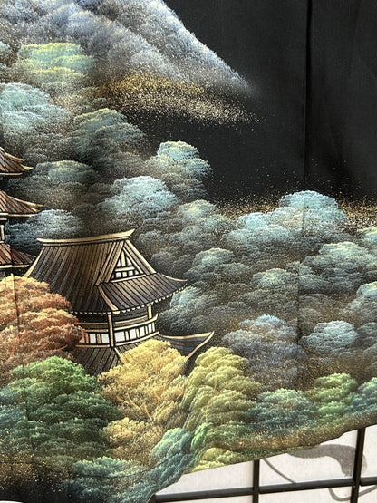 Black kimono wrap skirt, detail of temple roof and trees at hem