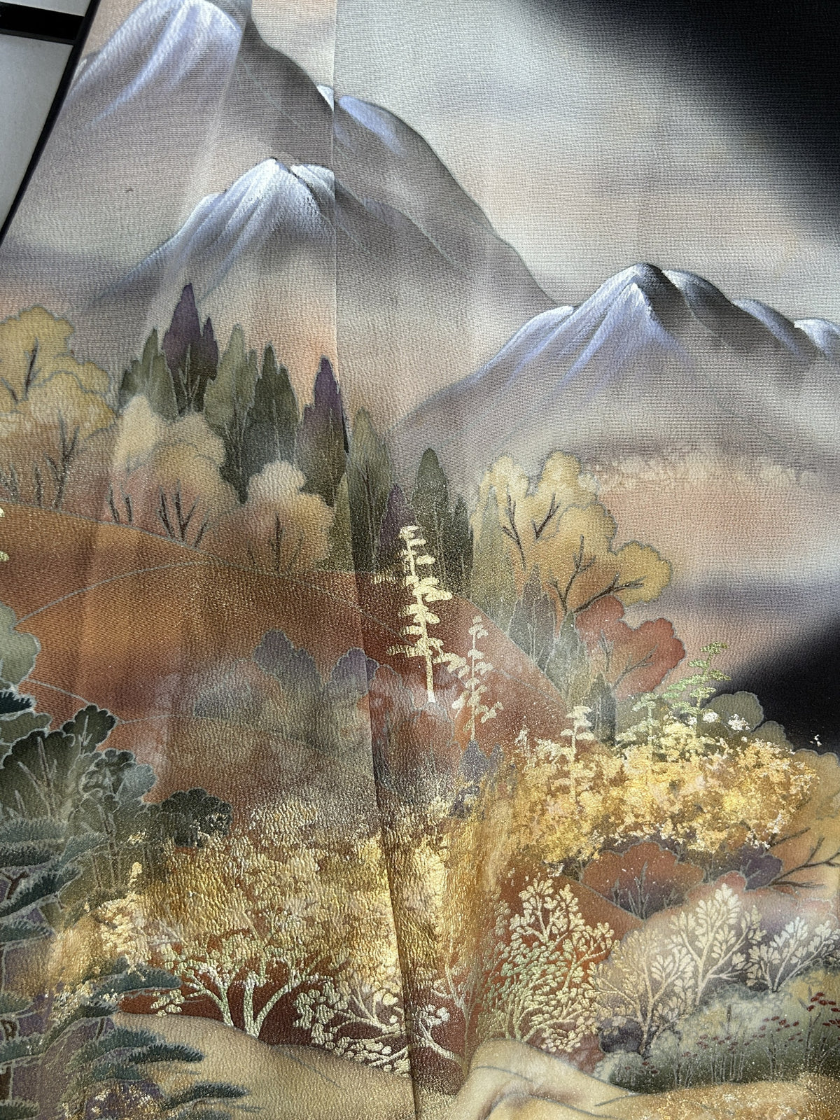 Black kimono wrap skirt, close-up of mountains and autumn trees
