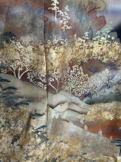 Black kimono wrap skirt, close-up of white and gold trees on hills