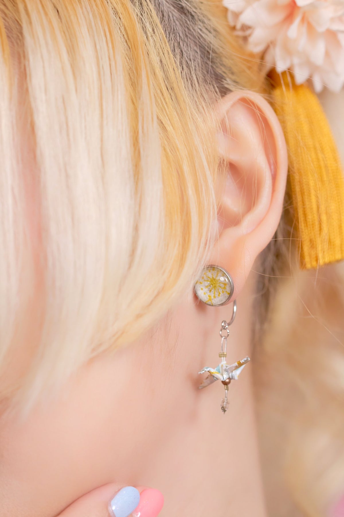 Crane & Cabochon Origami Earrings in silver worn by a model, close-up