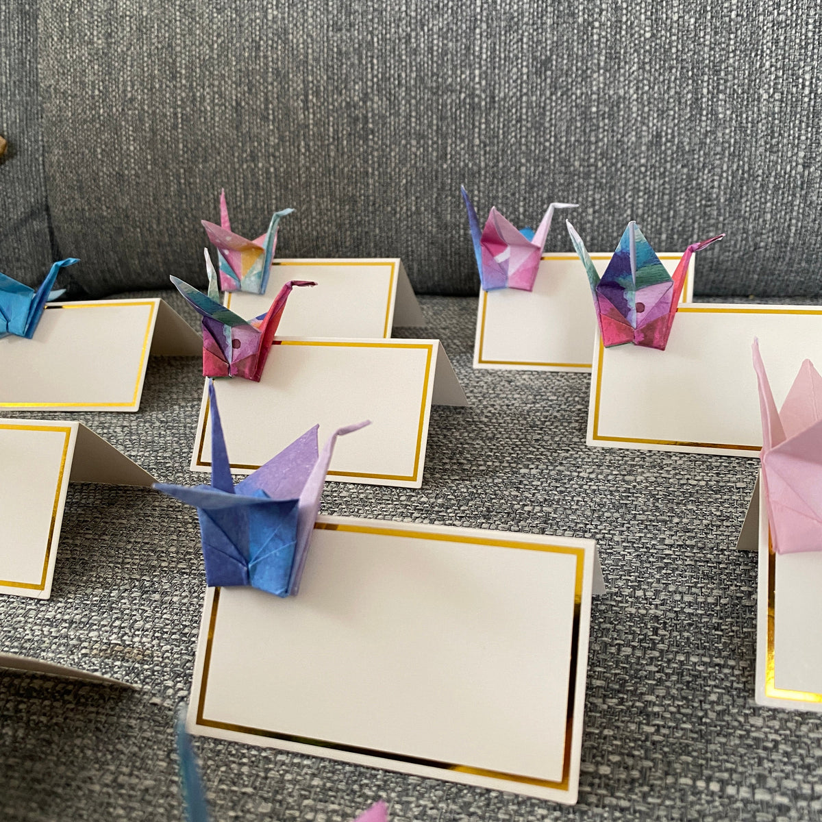 Origami crane place cards in watercolour galaxy paper, view 3