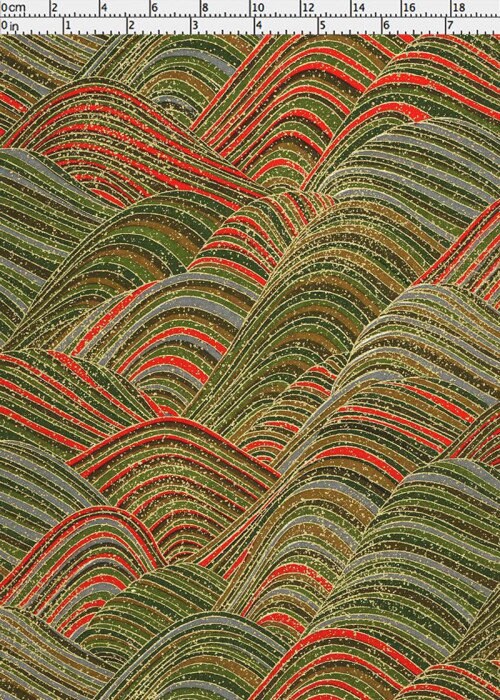 Chiyogami paper with wavy pattern in green, red, and gray with a ruler for scale
