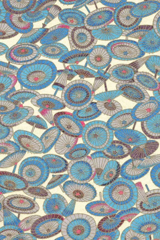 Patterned chiyogami paper with blue, brown, and beige circular designs on a beige background