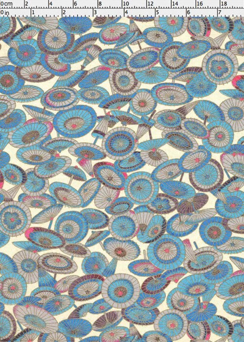 Patterned chiyogami paper with blue and brown circular designs on a beige background