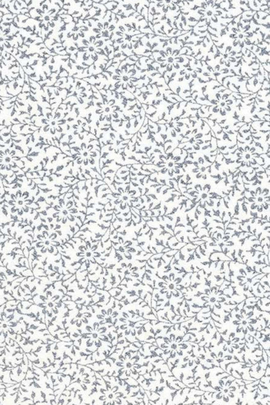 Patterned chiyogami paper with small floral designs on a white background