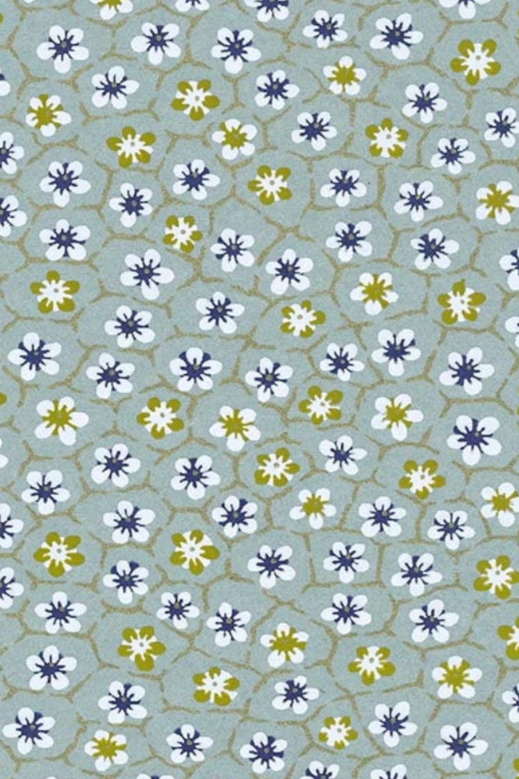 Pattern of small flowers on a light blue background