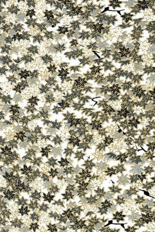 Patterned chiyogami paper with leaf design on a beige background