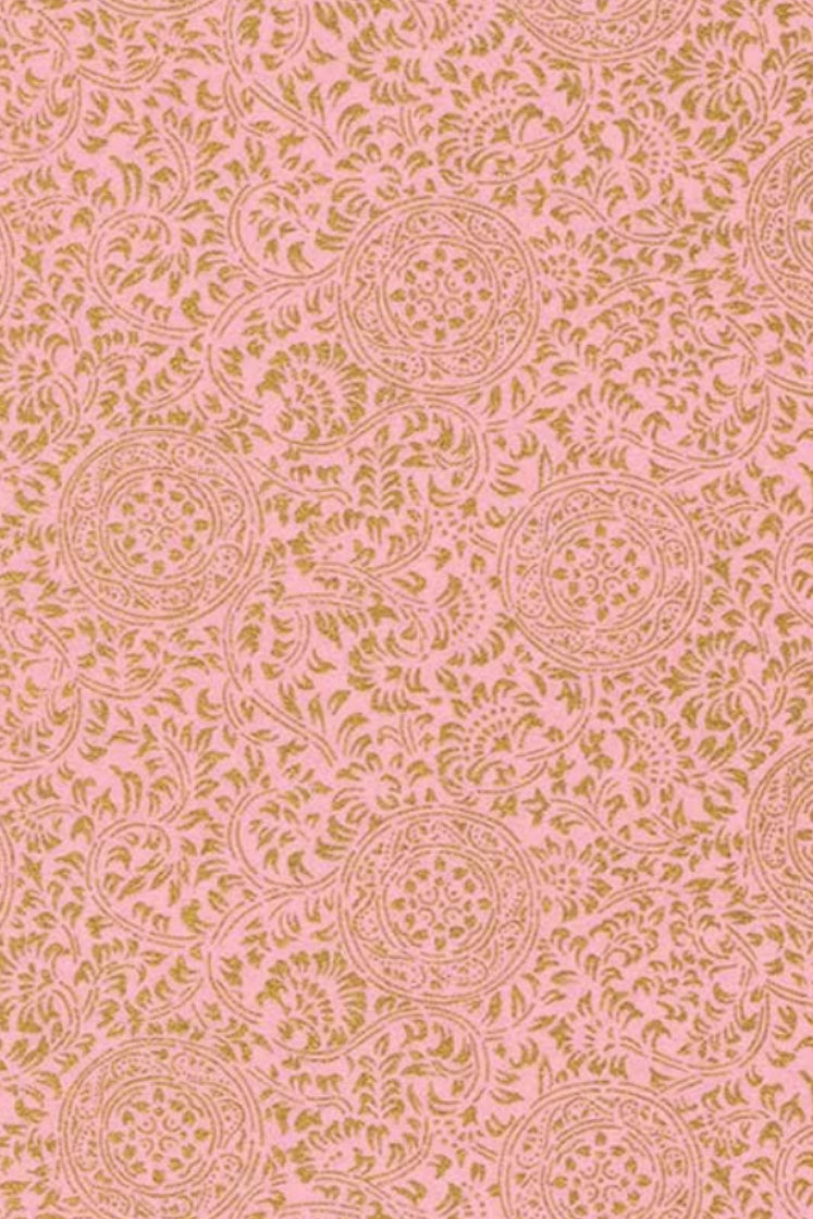 Floral patterned chiyogami paper on a pink background