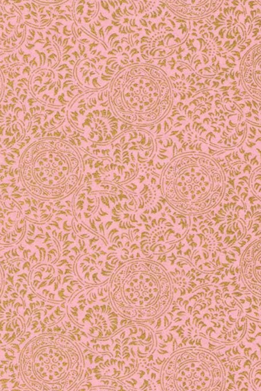 Floral patterned chiyogami paper on a pink background