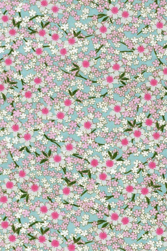 Chiyogami paper with Floral pattern with pink flowers and green leaves on a light blue background