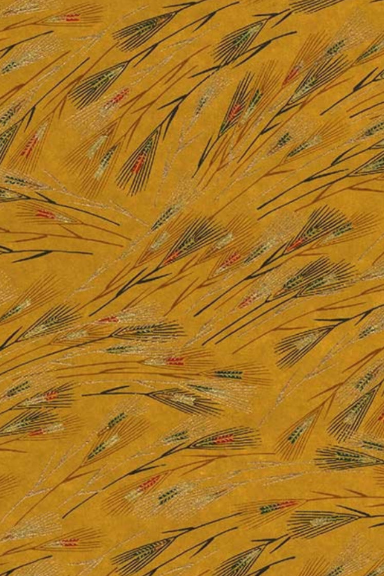 Patterned chiyogami paper with feather designs on a yellow background