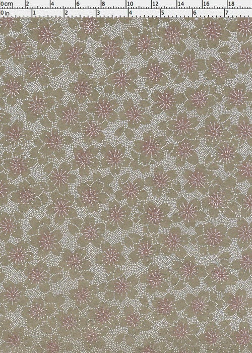 Floral patterned  chiyogami paper with a ruler for scale on a beige background