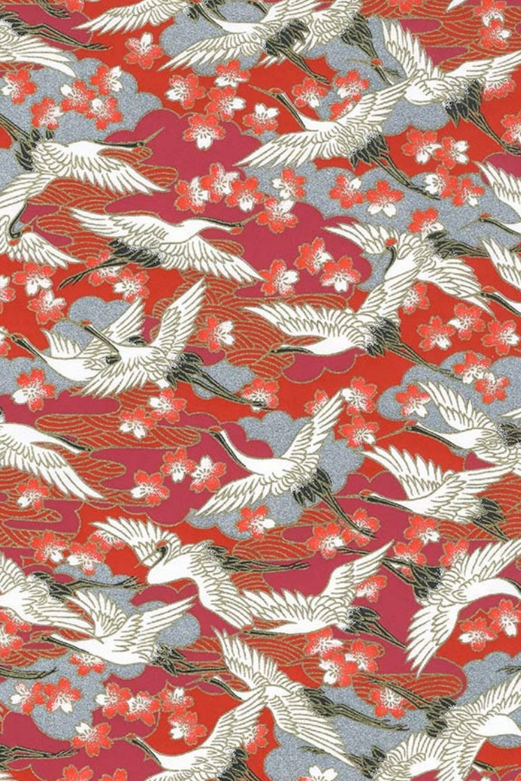 Chiyogami paper with Pattern of white cranes and cherry blossoms on a red background