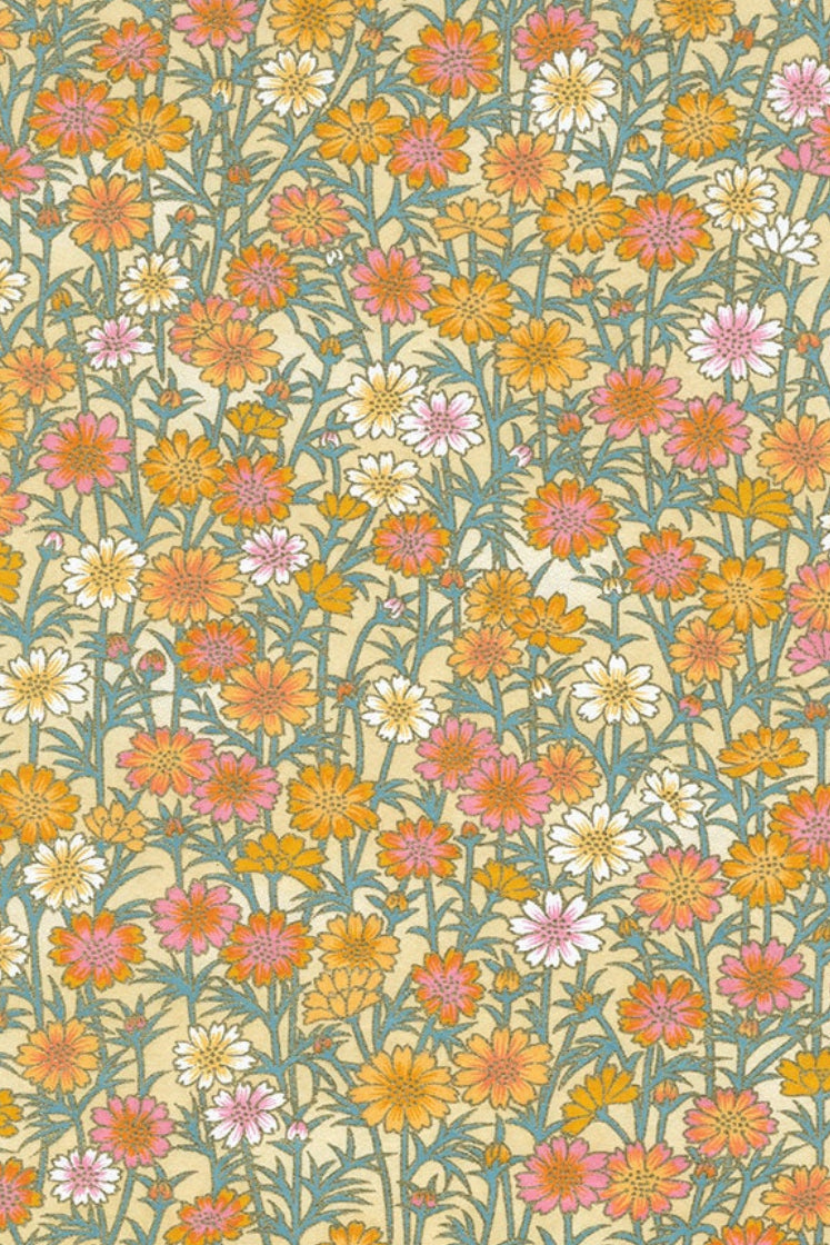 Patterned  chiyogami paper with a colorful floral design on a beige background