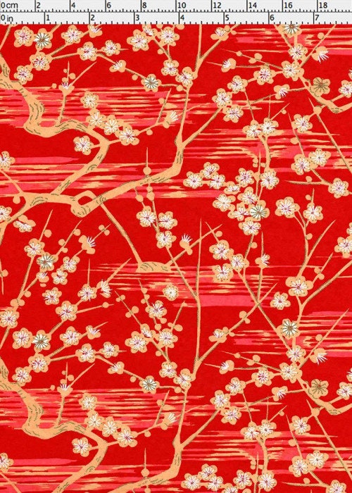 Floral pattern on red  chiyogami paper with a ruler for scale