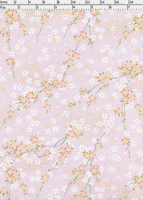 Chiyogami paper with Floral pattern on a light pink background with a ruler at the top.