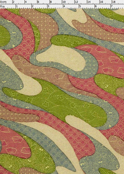 Patterned chiyogami paper with green, red, and beige colors on a white background