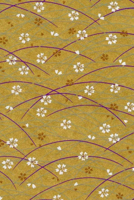 Patterned chiyogami paper with floral and wave design on a green background