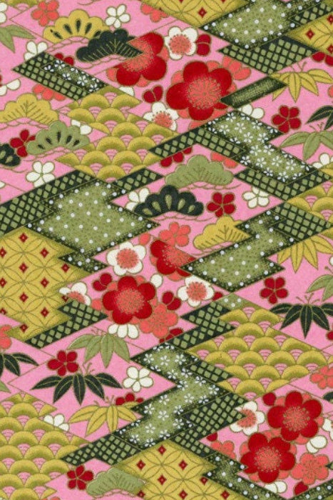 Colorful chiyogami paper pattern with geometric shapes and floral elements on a pink background