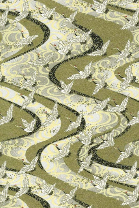 Patterned fabric with birds and wavy lines on a green background