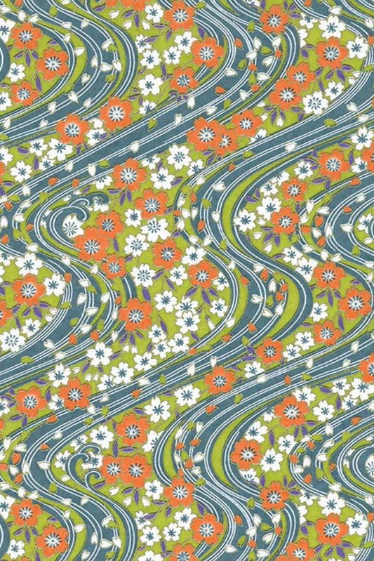 Patterned chiyogami paper with wavy lines and floral design in green, orange, and white.