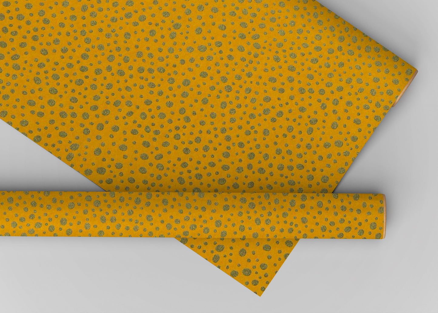 Yellow chiyogami paper with a subtle pattern on a light gray background