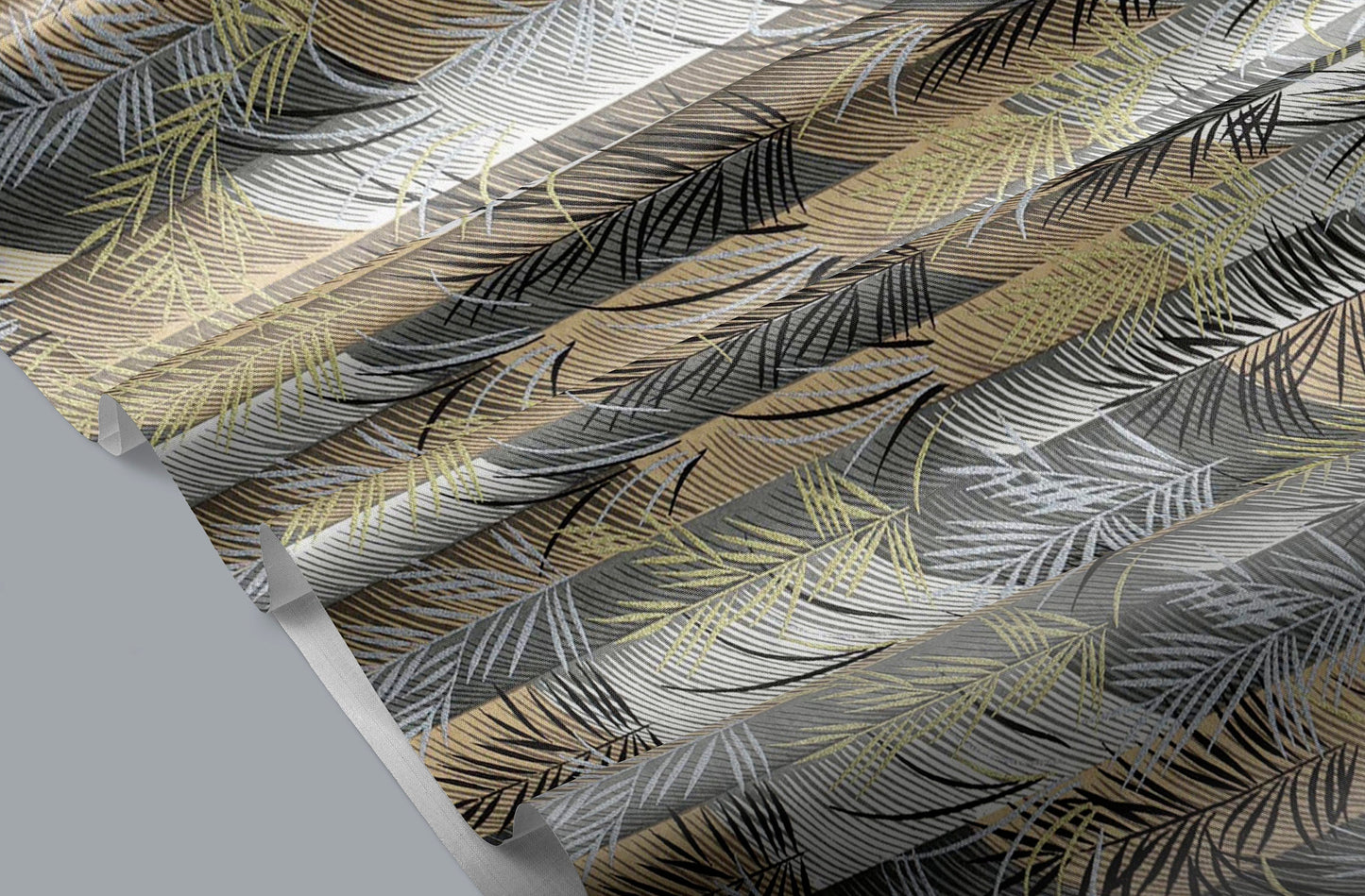 Close-up of a patterned chiyogami paper with feather design in black, gold, and gray.