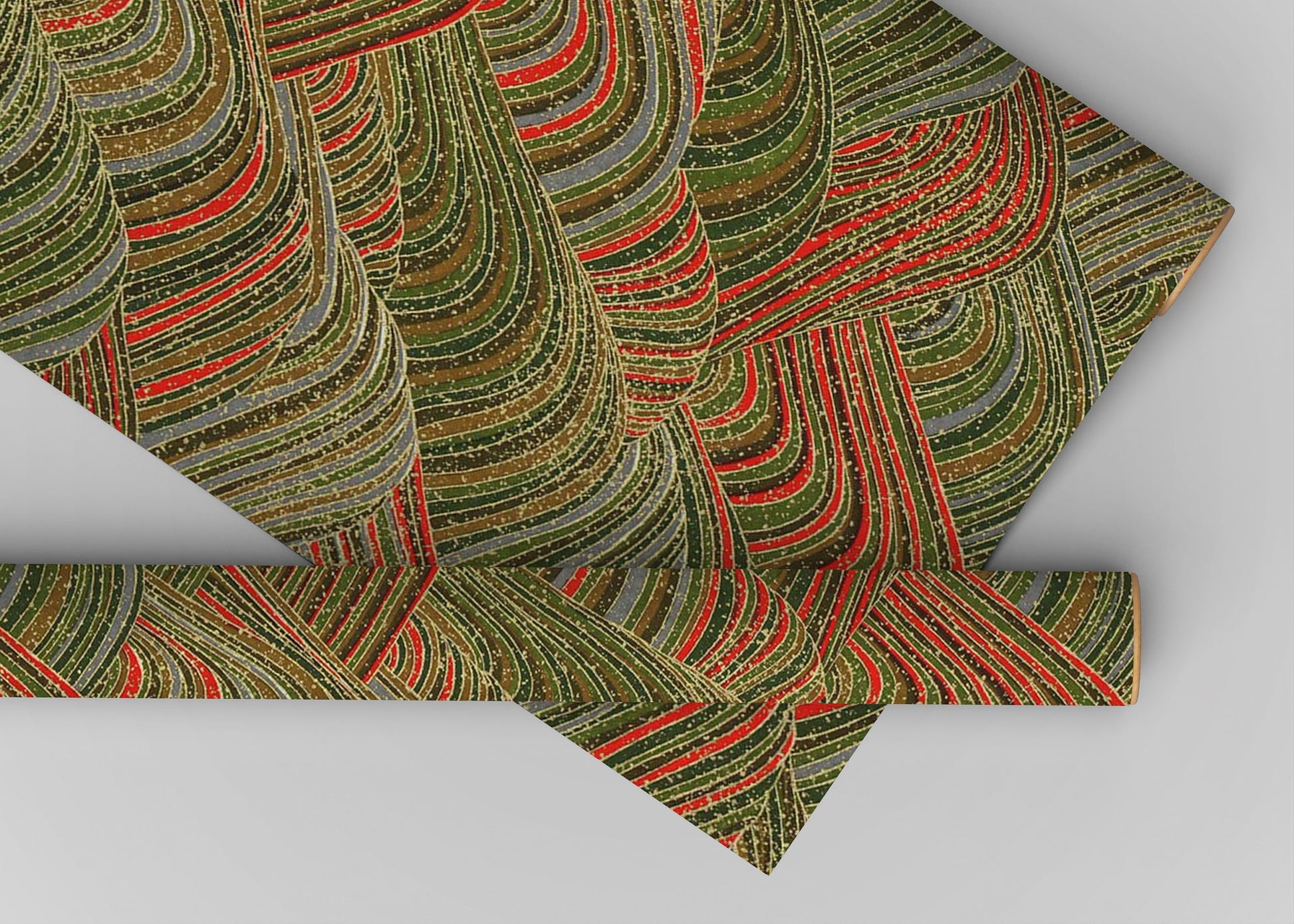 Patterned chiyogami paper with green and red design on a gray background