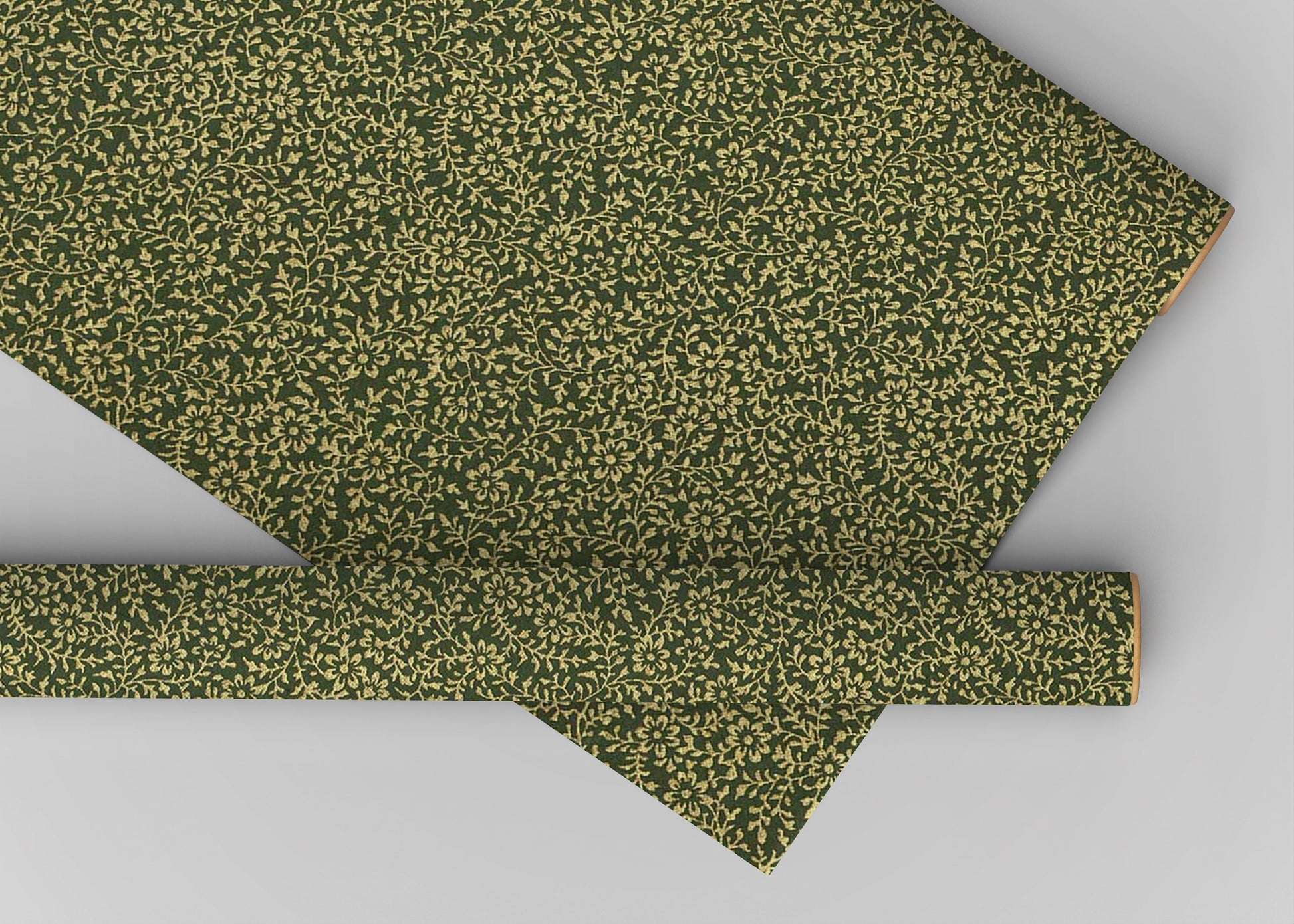 Green fabric with a subtle pattern on a gray background