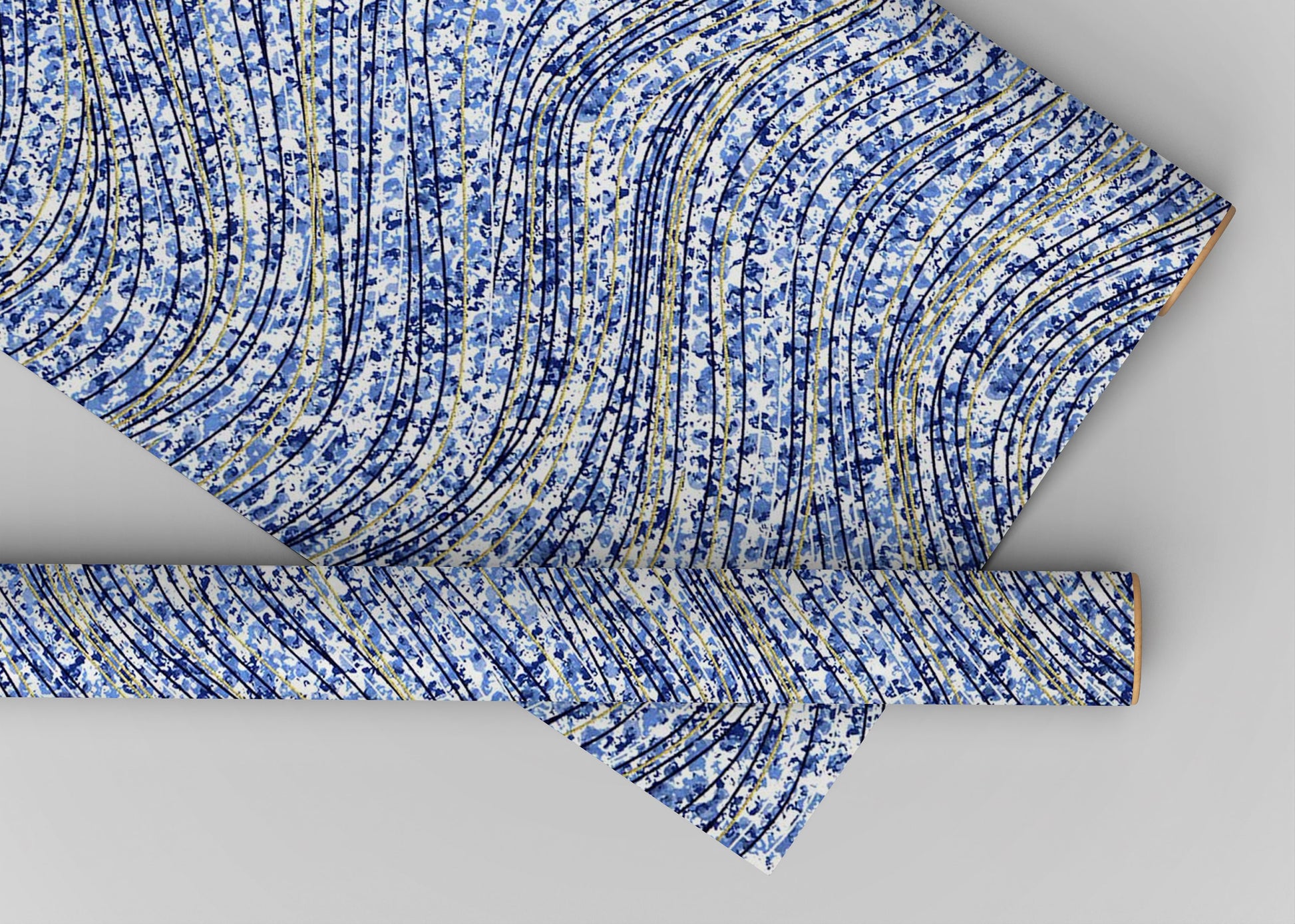 Blue and white patterned chiyogami paper on a gray background