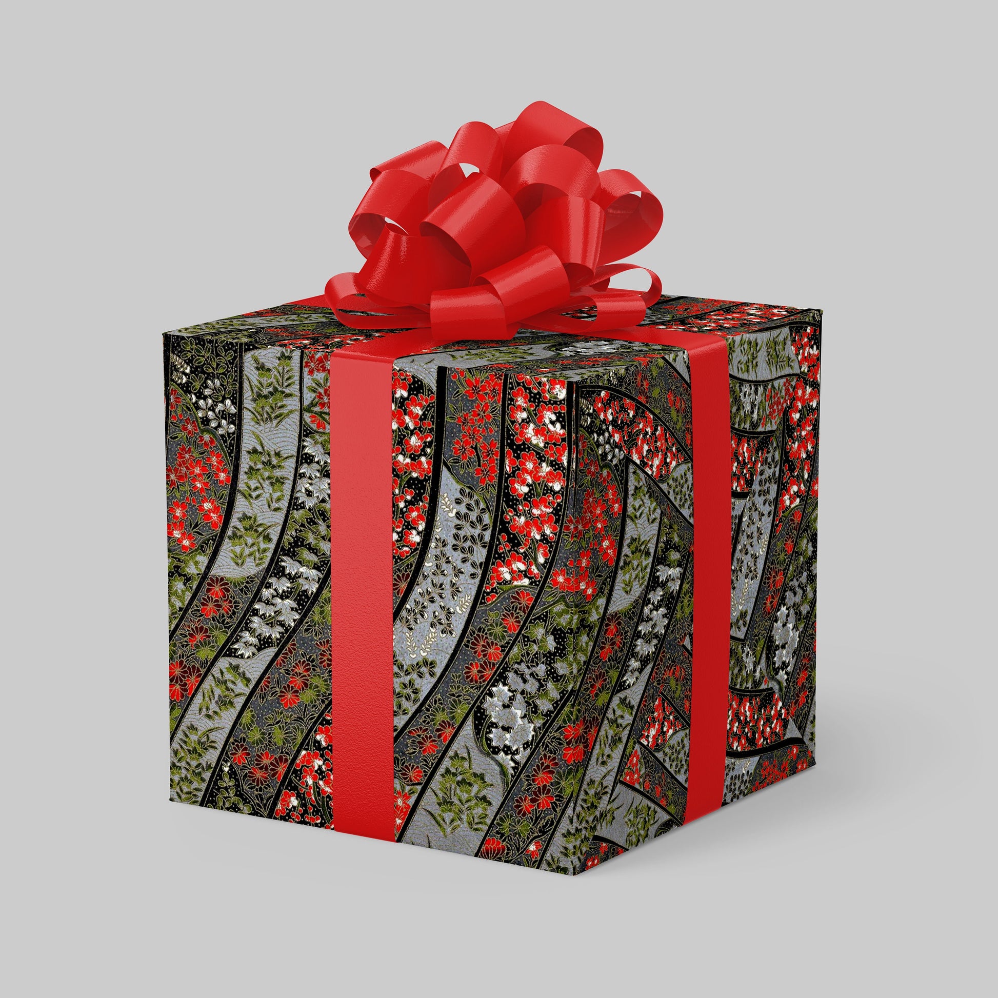 Gift box with floral pattern and red ribbon on a gray background