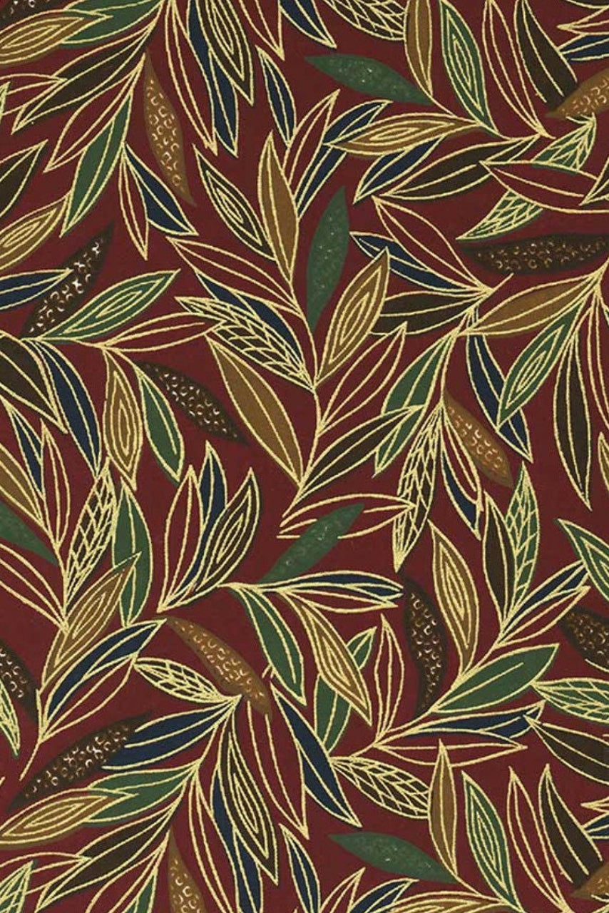Patterned chiyogami paper with leaves on a red background