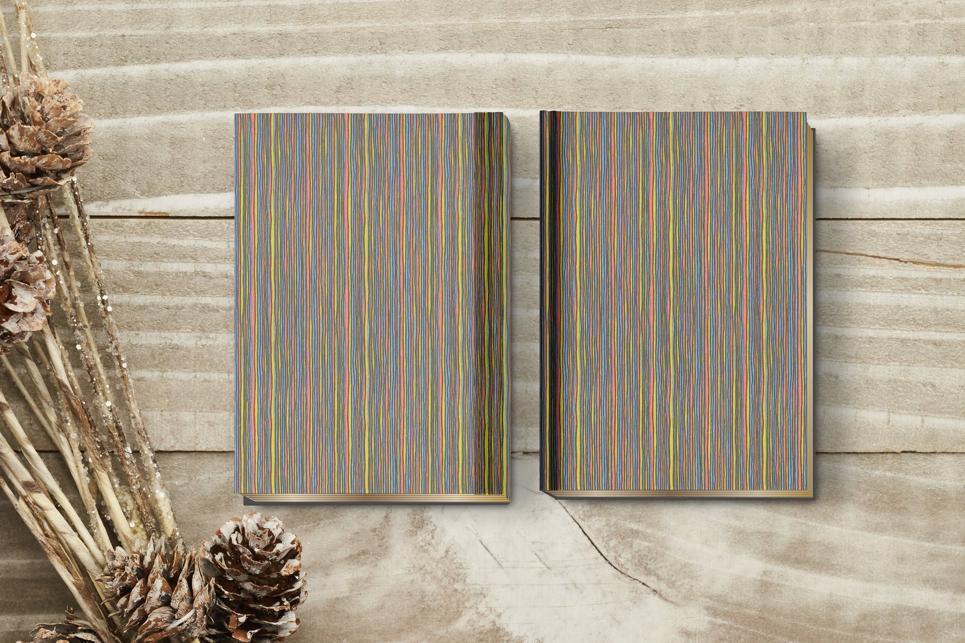 Two wooden panels with colorful striped patterns on a wooden surface.