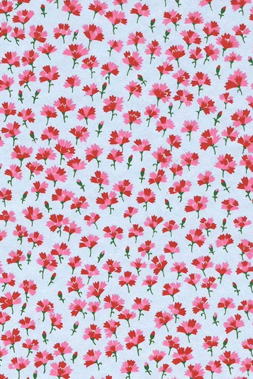 Pattern of small pink flowers on a light blue background