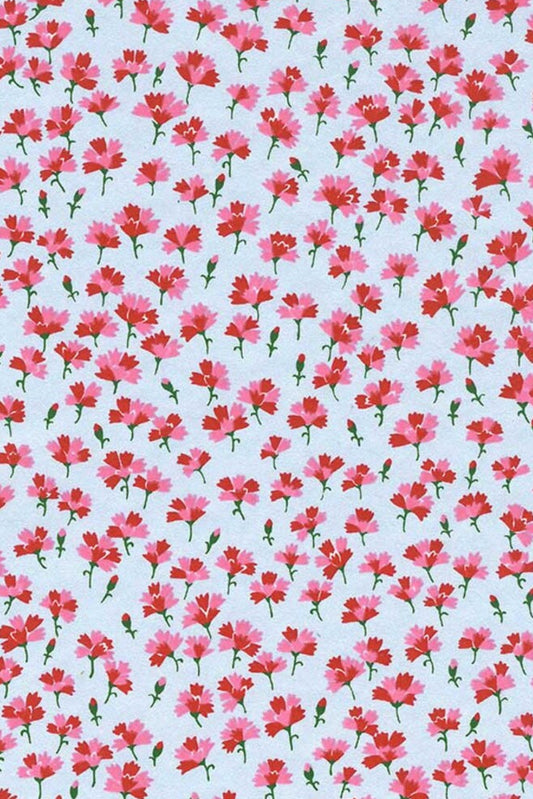 Pattern of small pink flowers on a light blue background
