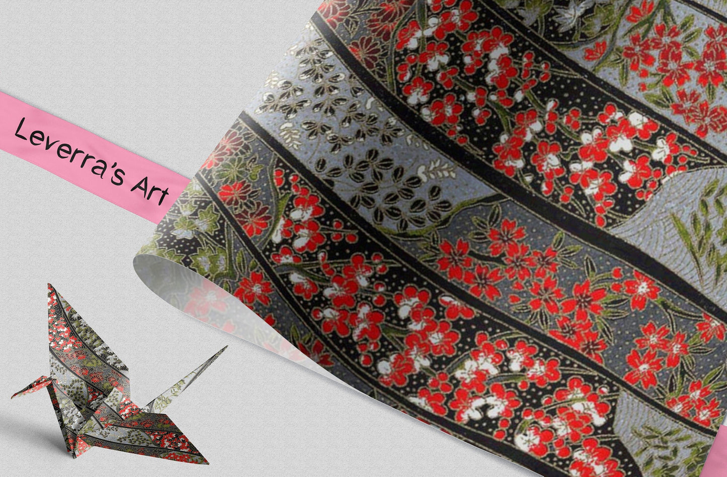 Decorative ribbon with floral pattern and a paper crane on a light gray background.