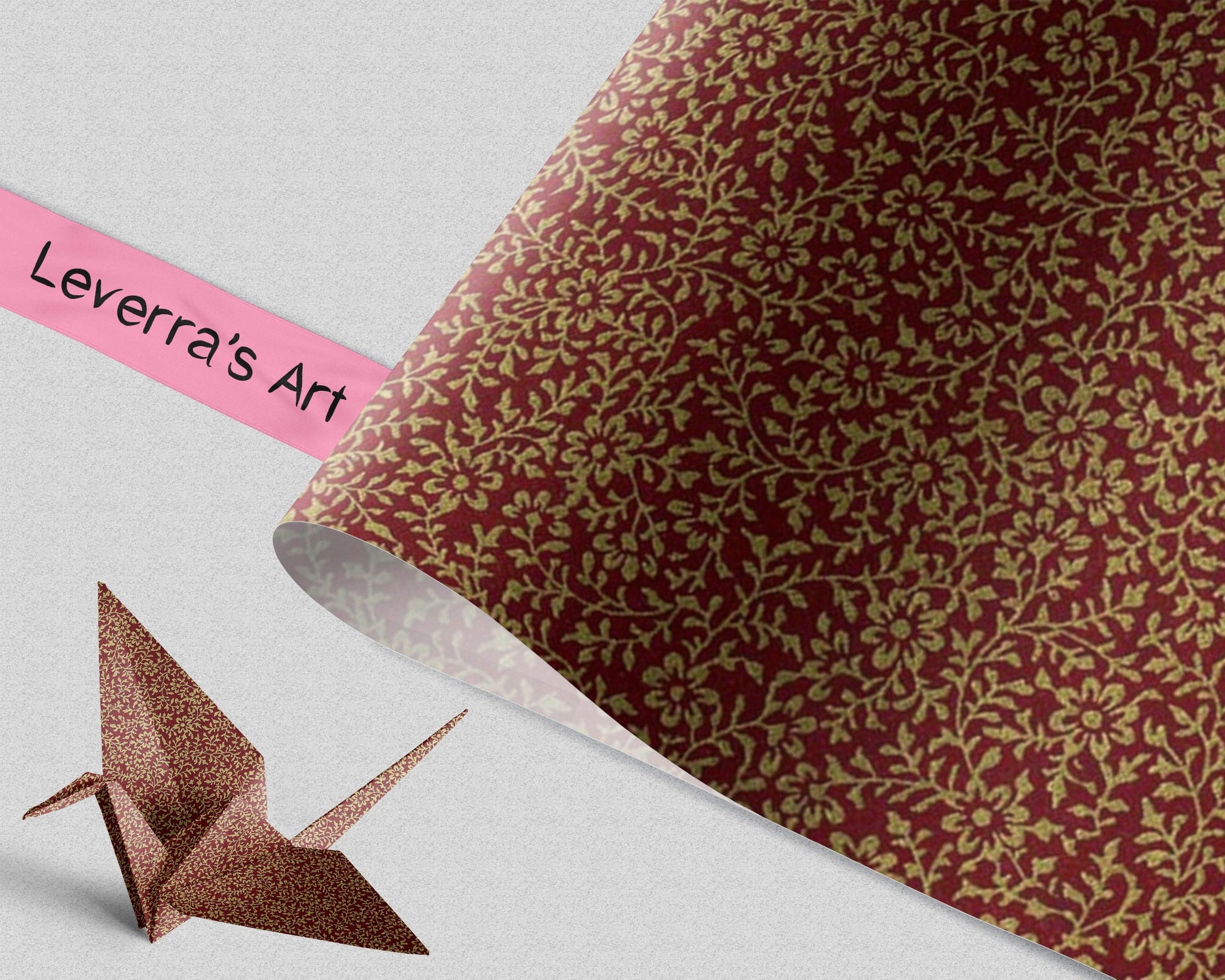 Decorative paper with floral pattern and an origami crane model on a plain background, featuring 'Leverra's Art' branding.