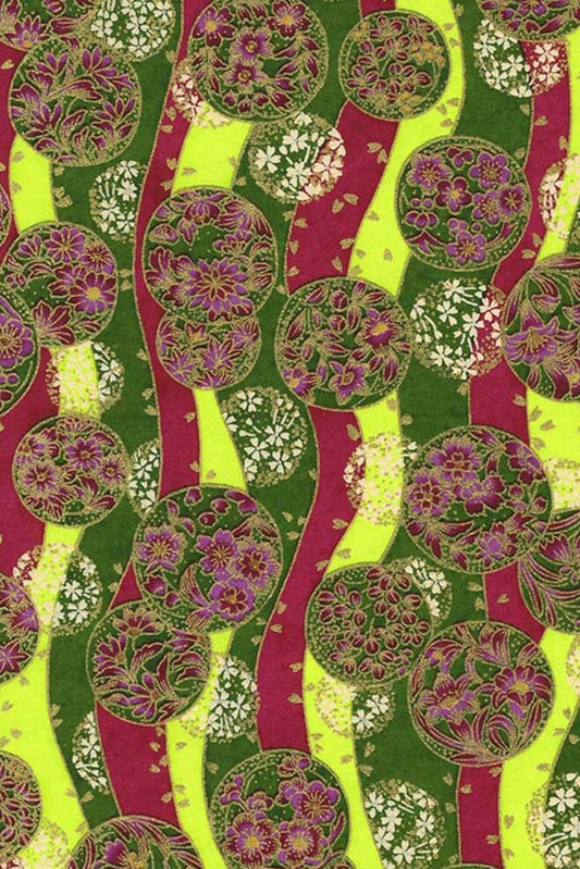 Colorful patterned fabric with green, pink, and yellow tree-like designs.